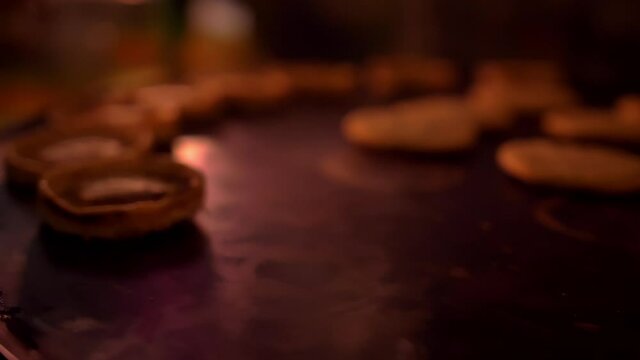 Row of small sopes on a black surface