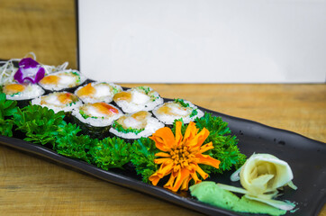 Delicious hossomaki on the decorated plate