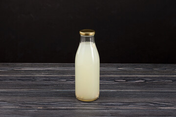 Rejuvelac or home made water kefir in glass bottle. Healthy fermented drink. Natural probiotic made...