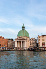 Fototapeta na wymiar Venice's canal, boat and traditional Venetian houses view. 