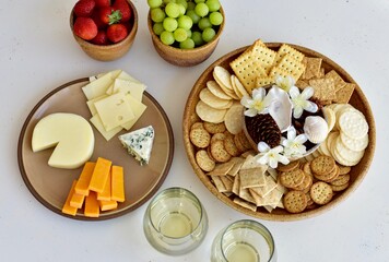 Gourmet wine and cheese charcuterie platter ordering out from restaurant for romantic date night at home on special occasion holiday or birthday. Photo concept, food lifestyle, background, close-up