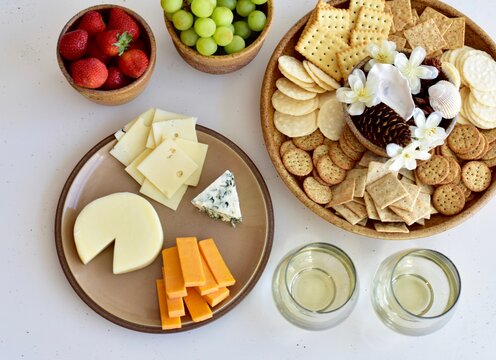 Gourmet wine and cheese charcuterie platter ordering out from restaurant for romantic date night at home on special occasion holiday or birthday. Photo concept, food lifestyle, background, close-up
