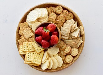 Charcuterie plate of cheese and crackers for party celebration and appetizer nibble tray at home 