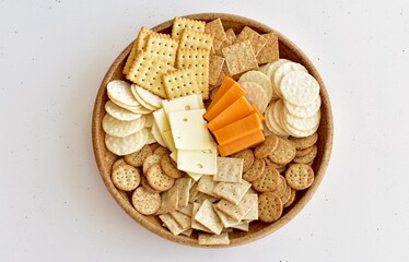 Charcuterie plate of cheese and crackers for party celebration and appetizer nibble tray at home 