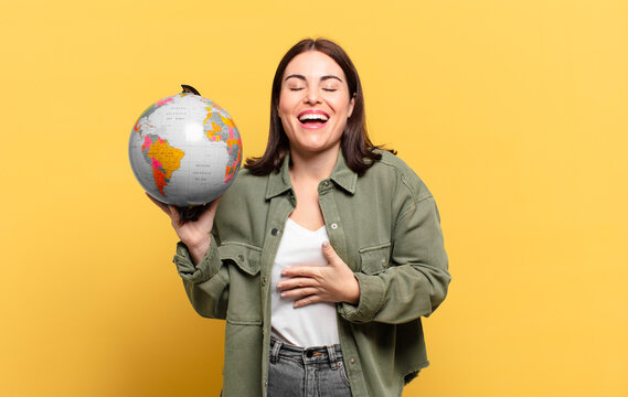 young pretty woman laughing out loud at some hilarious joke, feeling happy and cheerful, having fun