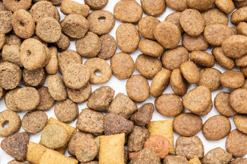 Fototapeta na wymiar variation domestic animals dry food isolated on white background. dry cat feed cut out. above view. collection