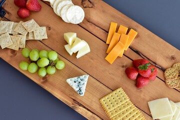 Gourmet wine and cheese charcuterie platter ordering out from restaurant for romantic date night at home on special occasion holiday or birthday. Photo concept, food lifestyle, background, close-up