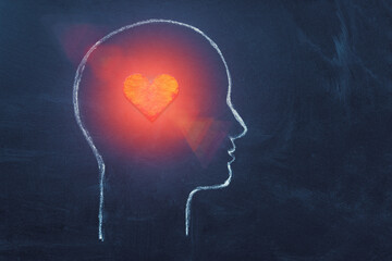 Shining Heart in human head. Love, instinct and romance concept. Chalk drawing. Copy space. Psychology, Valentine day, volunteer symbol. - 414262534