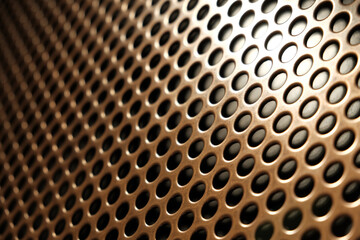 bronze shiny metal grille
 as an abstract background
