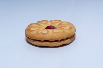Red centered jam biscuits with a strawberry flavor and on a plain white background