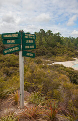 Signs at Lake Ngakoro and the Champagne Pool in Wai-O-Tapu Thermal Wonderland in Rotorua, New Zealand.