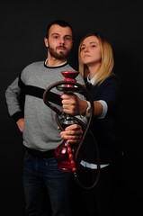 a man with a woman with hookah