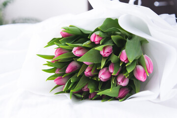 a bouquet of flowers Tulips on the bed
