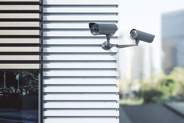 Security and protection concept with outdoor CCTV videocam on the corner of modern buisness center