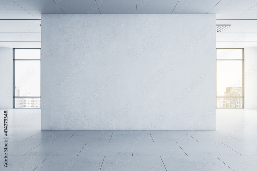 Poster light blank concrete wall in the center of empty hall room with big windows and city view. mockup