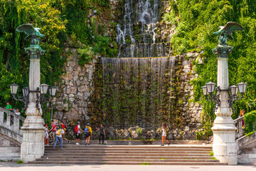 BUDAPEST, HUNGARY - JULY, 2019:   Gellért Hill Waterfall, man-made waterfall on Gellert Hill as a pair of Turul lampposts stand guard.