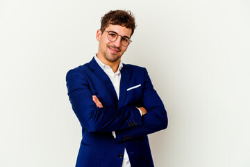 Fototapeta premium Young business caucasian man isolated on white background who feels confident, crossing arms with determination.