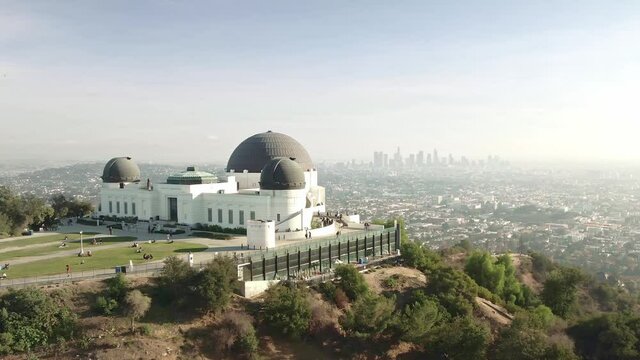 Aerial drone shot. Observatory Park Los Angeles. flying over Griffith Observatory. downtown Los Angeles skyline. California travel destination in America.