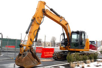 yellow excavator on a construction site