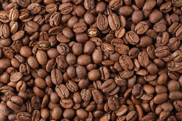Freshly roasted coffee beans background top view using for your advertising