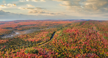 Sunset Autumn drive through the tunnel of Trees in Michigan Upper Peninsula UP - Highway 41  M26 Aerial view