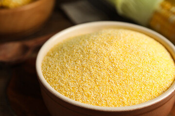 Pile of cornmeal in bowl, closeup view