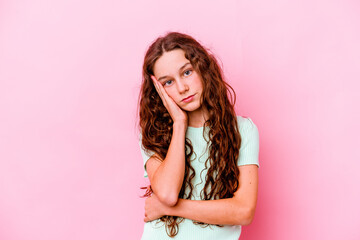 Little caucasian girl isolated on pink background blows cheeks, has tired expression. Facial expression concept.