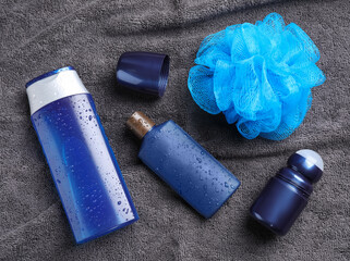 Flat lay composition with men's cosmetics on grey towel