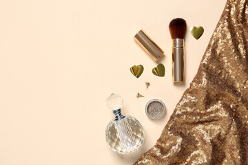 Flat lay composition with cosmetic products and shiny fabric, space for text