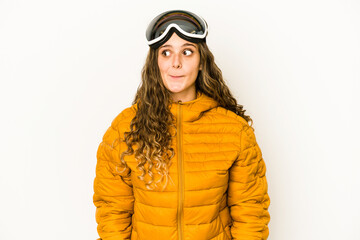 Young caucasian snowboarder woman isolated confused, feels doubtful and unsure.