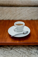 Espresso Cup  with Spoon on a Wooden Surface