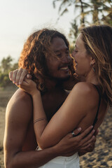 A close-up couple in love. woman and man smiling coming close to each other's faces and cuddling. High quality photo