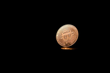 Gold digital coin on black table background