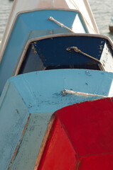 Five wooden boats by the beach close up 