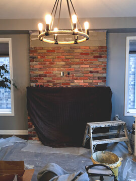 Tiling Up Fireplace With Brick Veneer