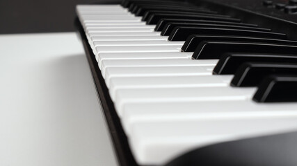 Fototapeta na wymiar synthesizer keys, musical instrument piano closeup