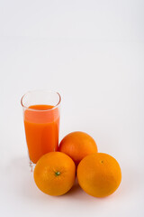 oranges and orange juice on white background