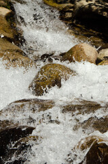 River water flowing into the rocks.