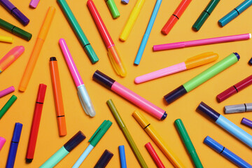 Different school stationery on yellow background, flat lay