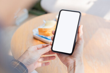 cell phone blank white screen mockup.woman hand holding texting using mobile on desk at office.background empty space for advertise.work people contact marketing business,technology
