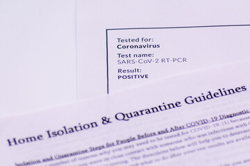 Positive coronavirus test result document. Home isolation and quarantine guidelines. Selective focus
