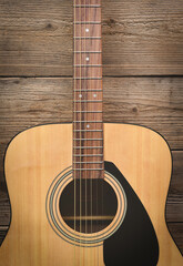 Home hobbies, Guitar resting on old wooden background, Close up acoustic guitar - top view Musical instrument for recreation or hobby passion concept.