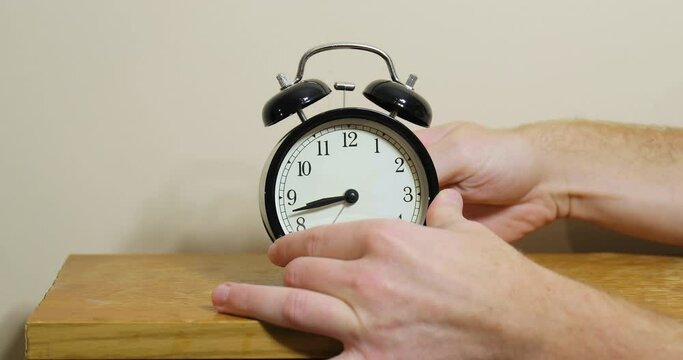 Setting clock back by one hour for ending summer daylight saving time in the autumn in October