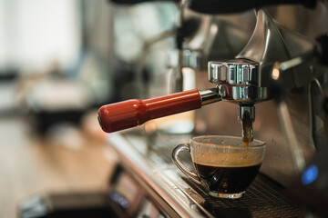 Close up view of preparing coffee espresso in automatic coffee machine in cafe