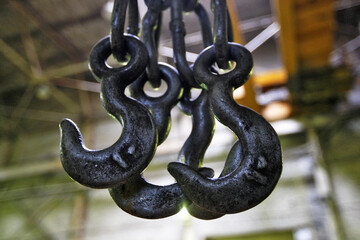 large metal hooks in a factory 