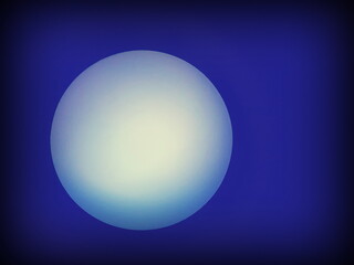Abstract image shading parts of a spherical light bulb on a blue background. The concept of the full moon lit up in the night sky
