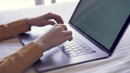 laptop typing with hands work at home internet technology