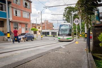 Obraz premium Medellin, Antioquia, Colombia. February 29, 2020. Metroplús is a medium capacity rapid transit bus system that serves the city of Medellín and the Aburrá Valley in Antioquia, Colombia.