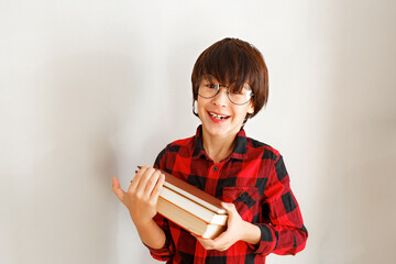 Young Boy Student Nerd Holding Books © Olga Gimaeva
