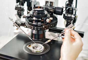 Medical research using the microscope in a laboratory of a Clinic of Reproductive medicine,closeup.